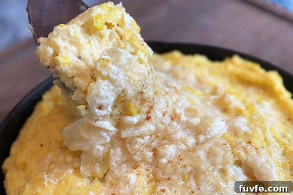 Spicy Sweet Corn Polenta Recipe — Creamy, Savory, Zesty 6 spicy sweet corn polenta with cheese on top in cast iron pan