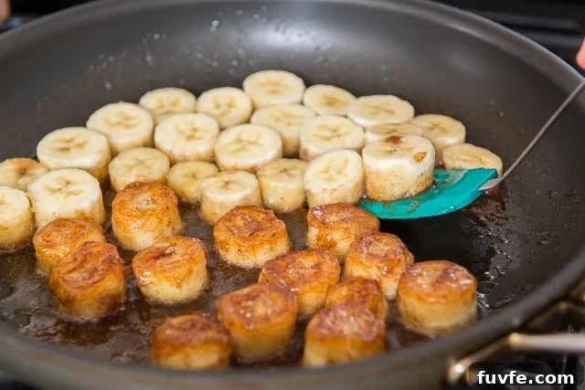 Caramelized Honey Pan-Fried Bananas Recipe 7 Flipping over the banana slices as they become caramelized