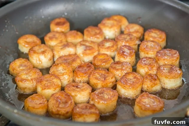 Caramelized Honey Pan-Fried Bananas Recipe 8 Caramelized fried bananas in skillet with honey and cinnamon