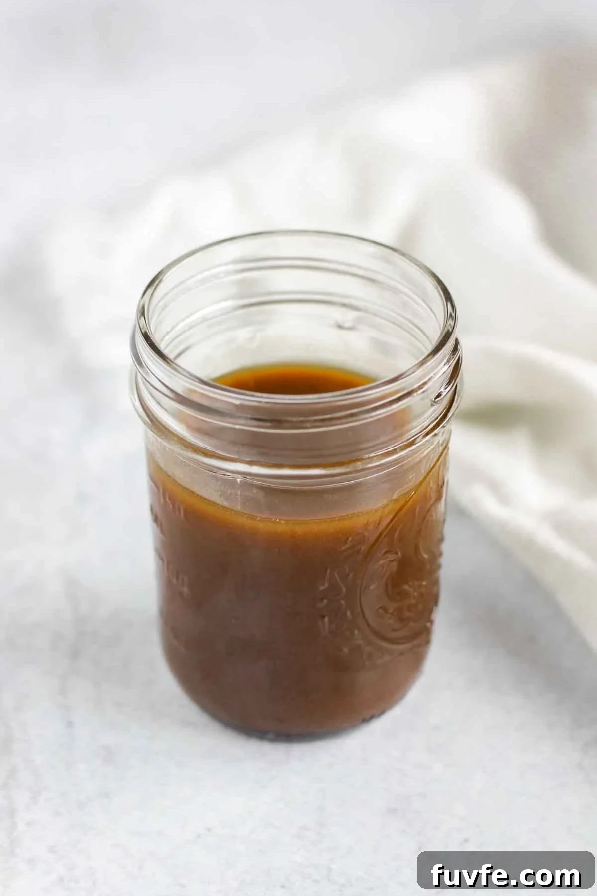 Balsamic vinaigrette dressing in a mason jar.