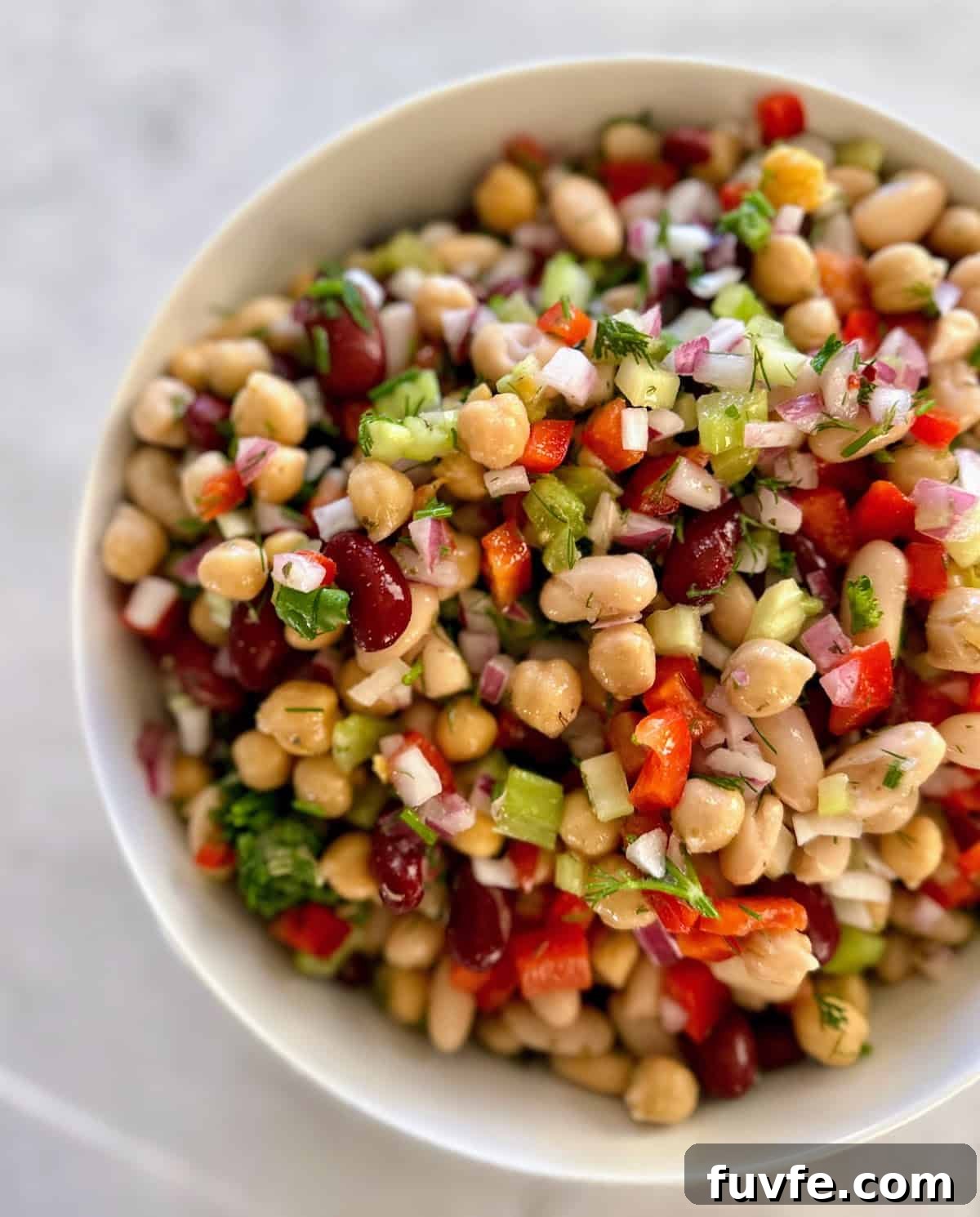 Oil-Free Bean Salad with Zesty Vinaigrette 8 Three bean salad in a bowl on the table.