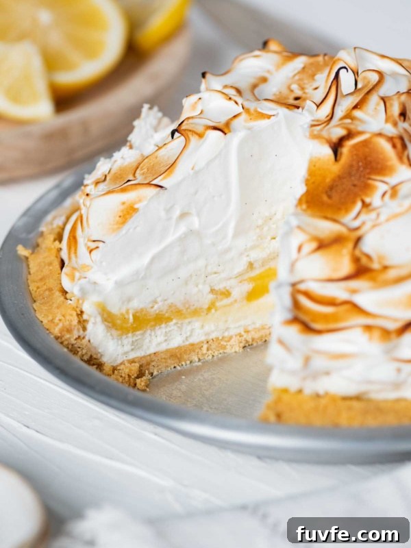 Lemon Meringue Ice Cream Pie with slice removed.