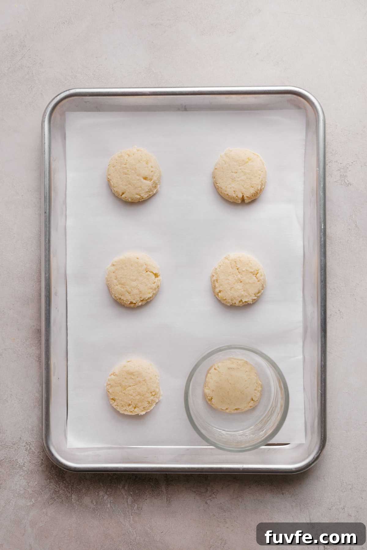Lemon shortbread cookie dough with flattened tops using the bottom of a glass bowl.