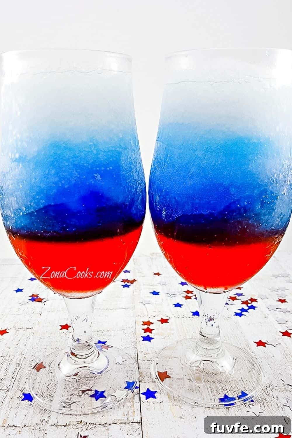 Red, White and Blue Rum Slush in two tall glasses.