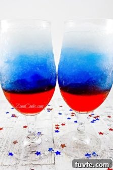 Red, White and Blue Rum Slush in two tall glasses.