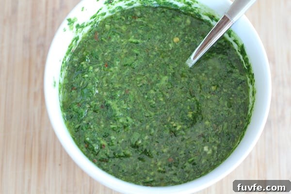 A bowl of chimichurri sauce.