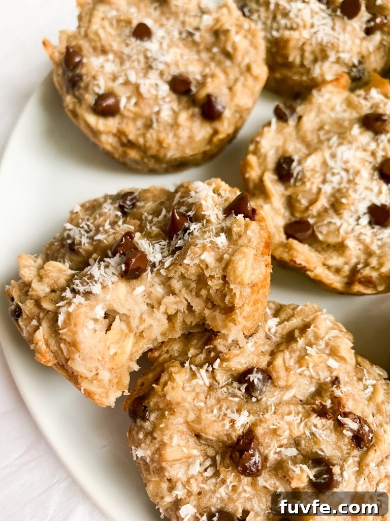 a plate of oatmeal cups, one with a bite taken out