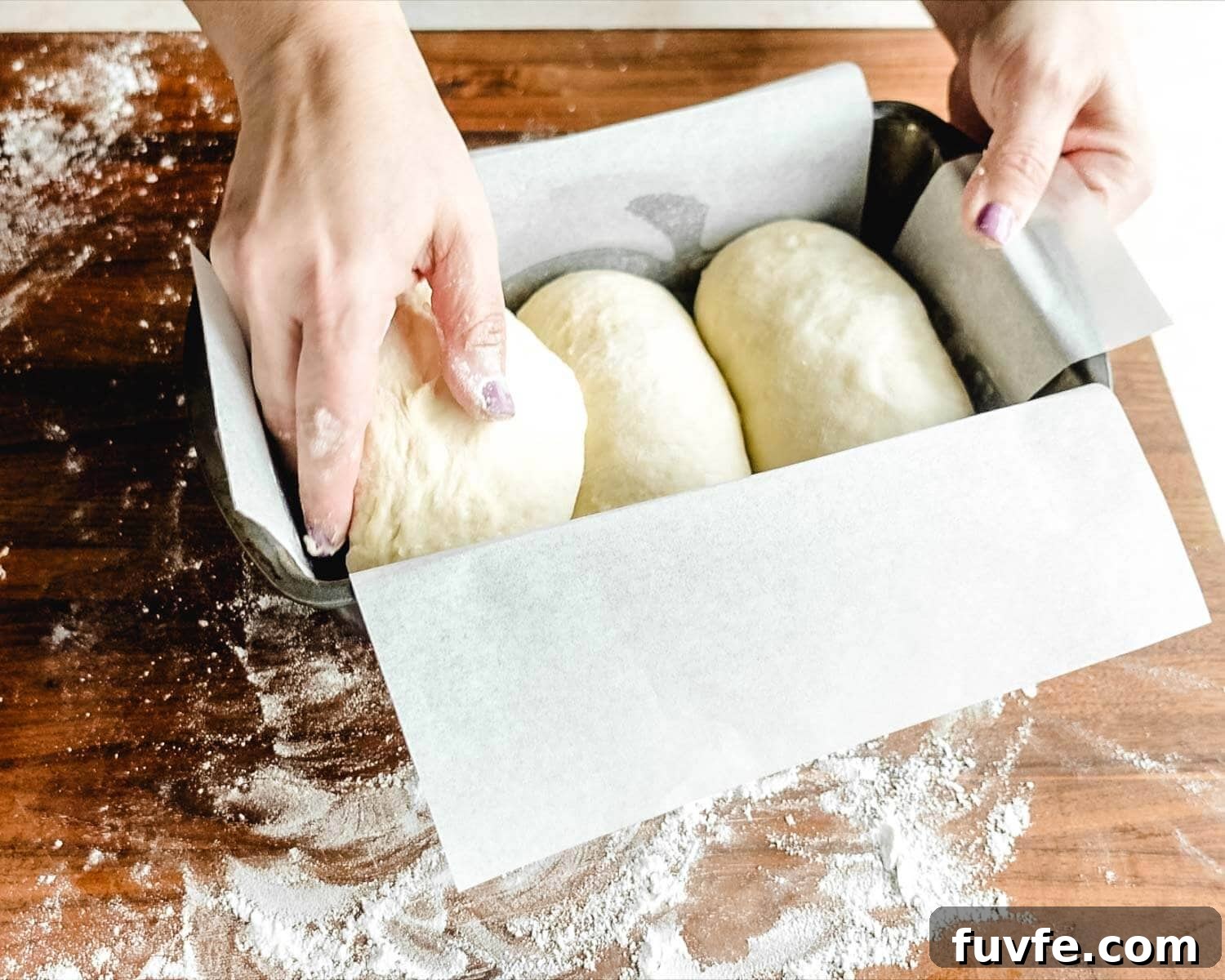 Creamy Condensed Milk Bread Recipe for Soft Homemade Loaf 25 Place three pieces of dough in loaf pan next to each other.
