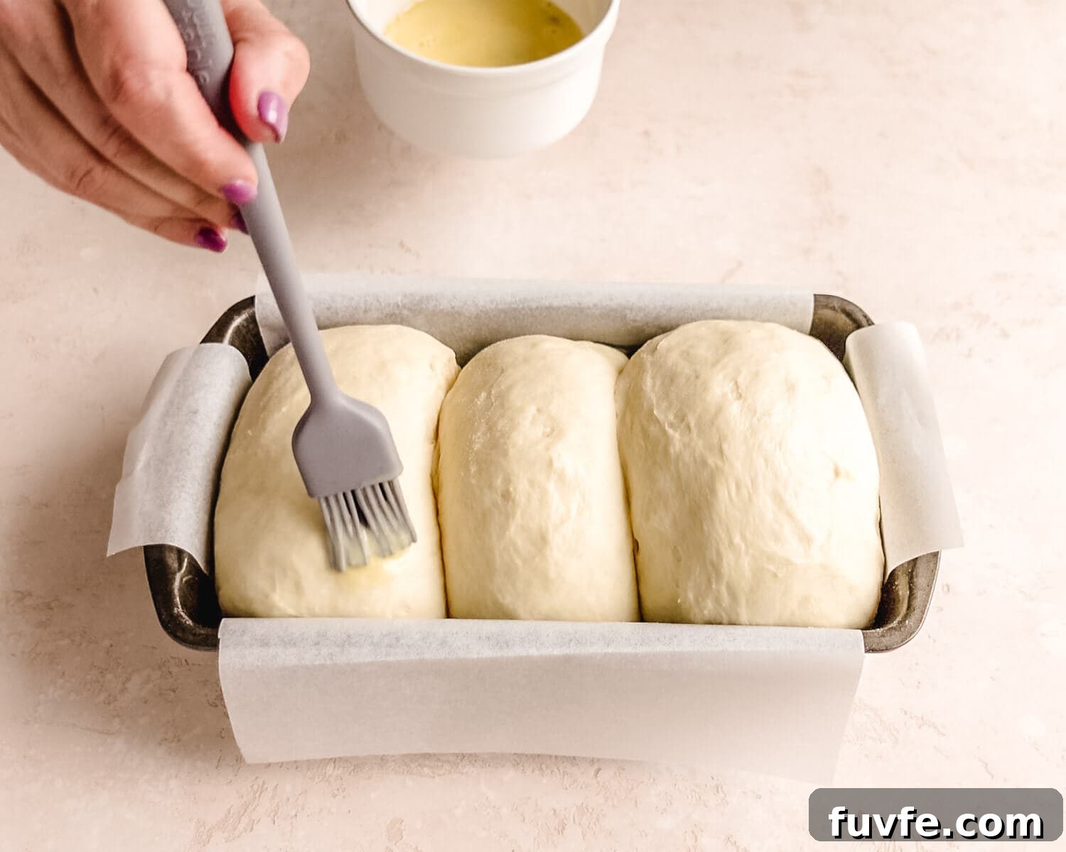 Creamy Condensed Milk Bread Recipe for Soft Homemade Loaf 29 Brush dough gently with egg wash.