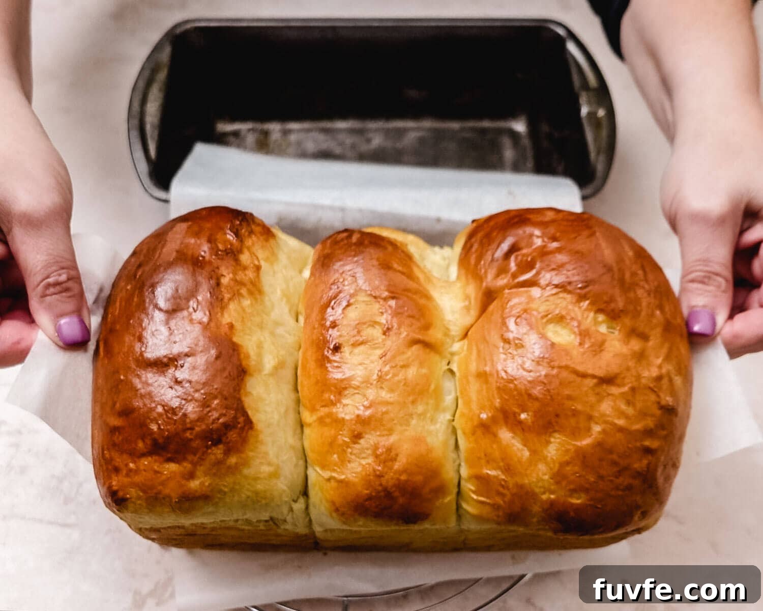 Creamy Condensed Milk Bread Recipe for Soft Homemade Loaf 31 Use parchment overhang to lift baked bread out of the loaf pan.