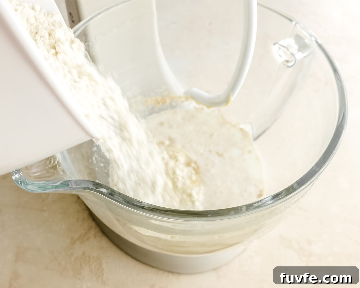 Creamy Condensed Milk Bread Recipe for Soft Homemade Loaf 8 Add flour to mixing bowl.