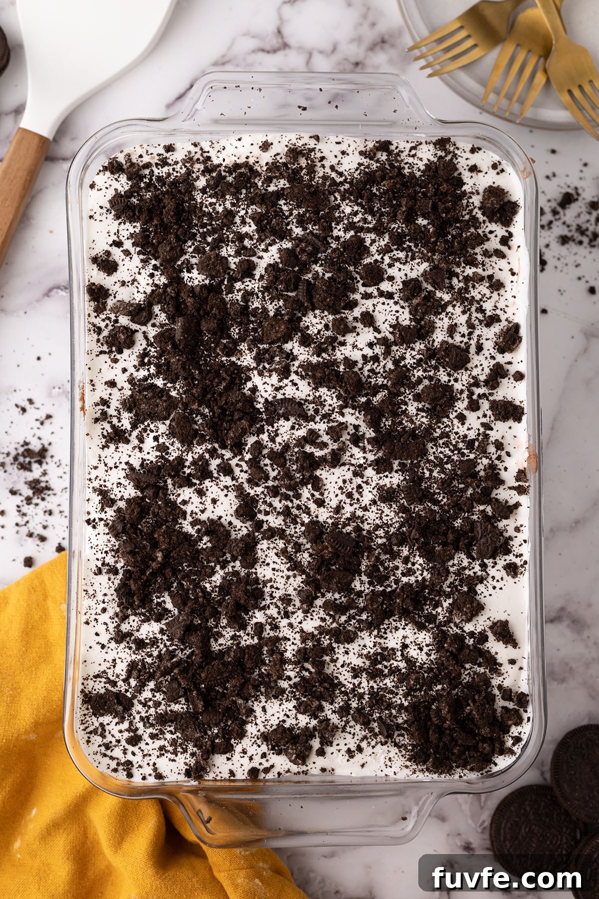 A layer of crushed Oreos on top of chocolate lasagna.