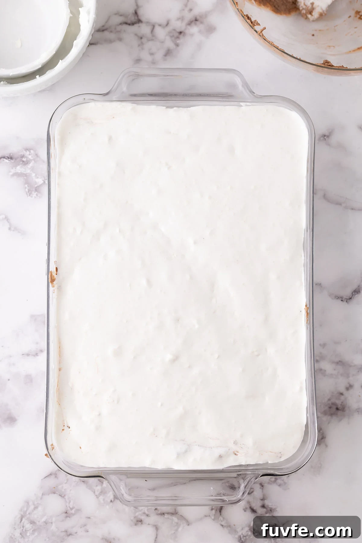 Top vanilla whipped cream layer in the rectangle glass dish.