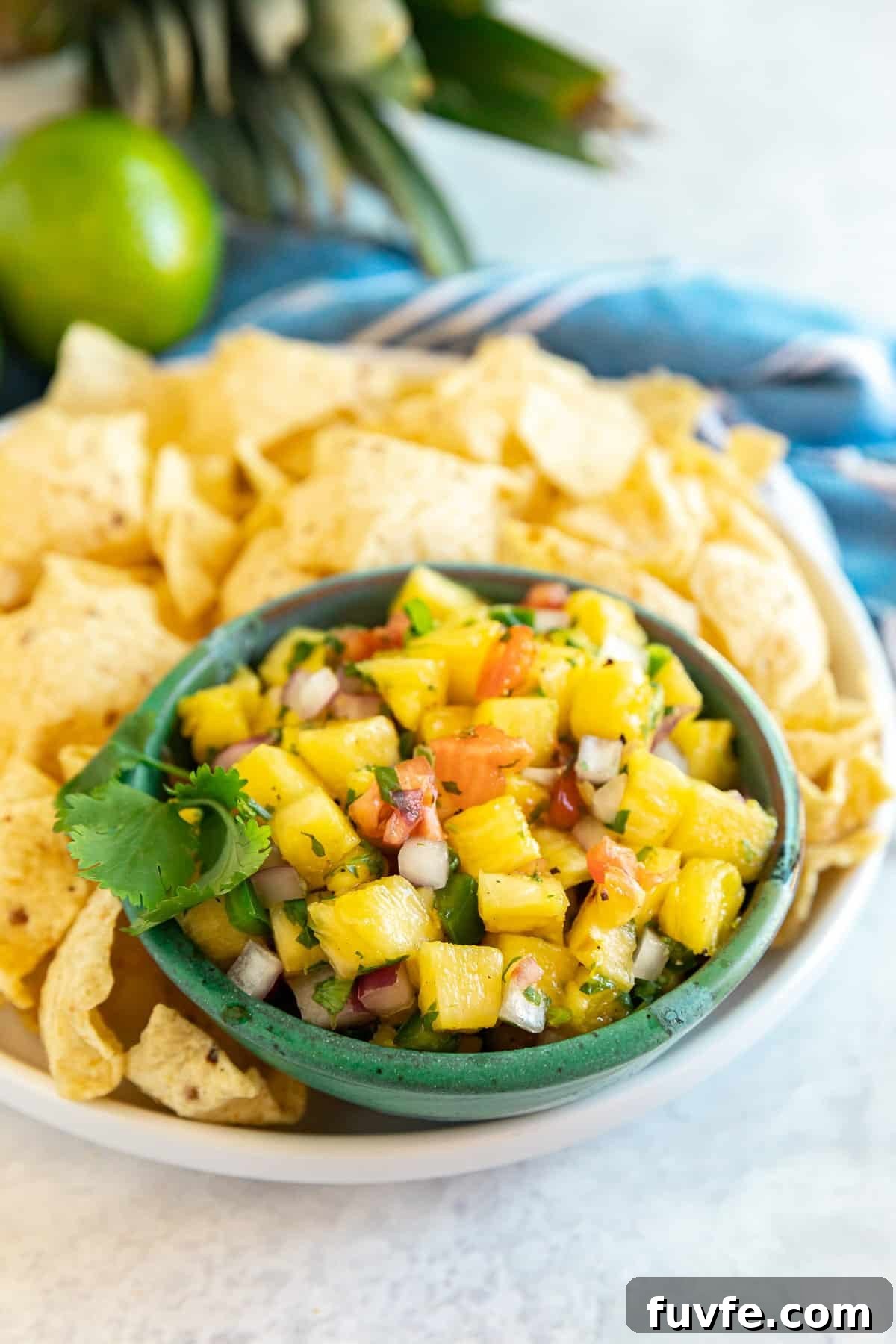 Pineapple salsa in a bowl with chips.