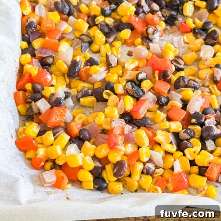 A close up image of the corner of the pan of corn salsa.