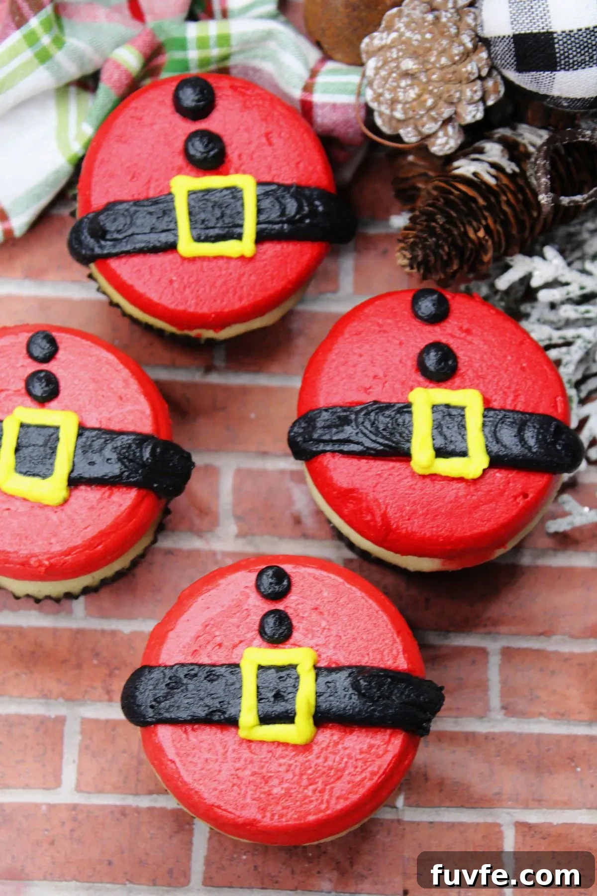 A few homemade gluten and dairy free cupcakes decorated to look like Santas belly and his belt.
