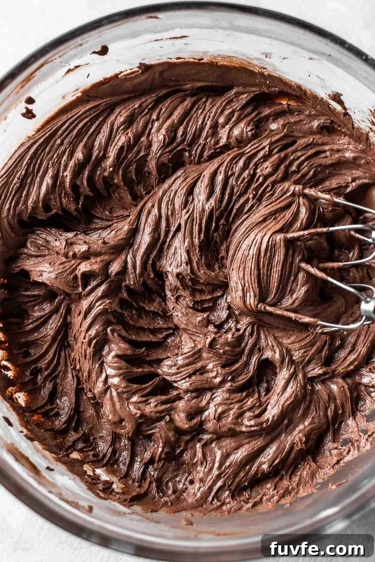 Classic Marble Cake Recipe with Swirled Chocolate-Vanilla Layers 11 marble cake chocolate frosting in bowl