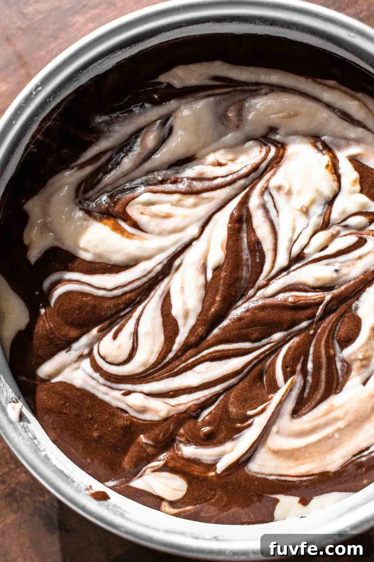 Classic Marble Cake Recipe with Swirled Chocolate-Vanilla Layers 10 marble cake swirled batter in cake pan