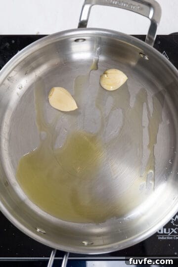 Lemon Spinach Pasta Recipe: Bright 20-Minute Weeknight Meal 6 Sauteing whole crushed garlic in a pan.