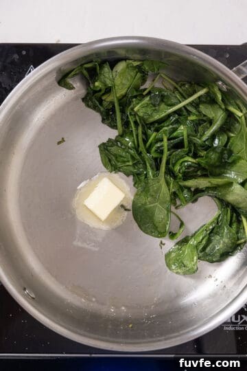 Lemon Spinach Pasta Recipe: Bright 20-Minute Weeknight Meal 8 Butter added to spinach in a pan.