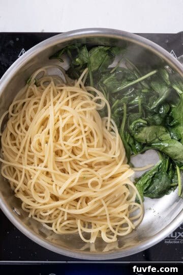 Lemon Spinach Pasta Recipe: Bright 20-Minute Weeknight Meal 9 Pasta added to spinach.