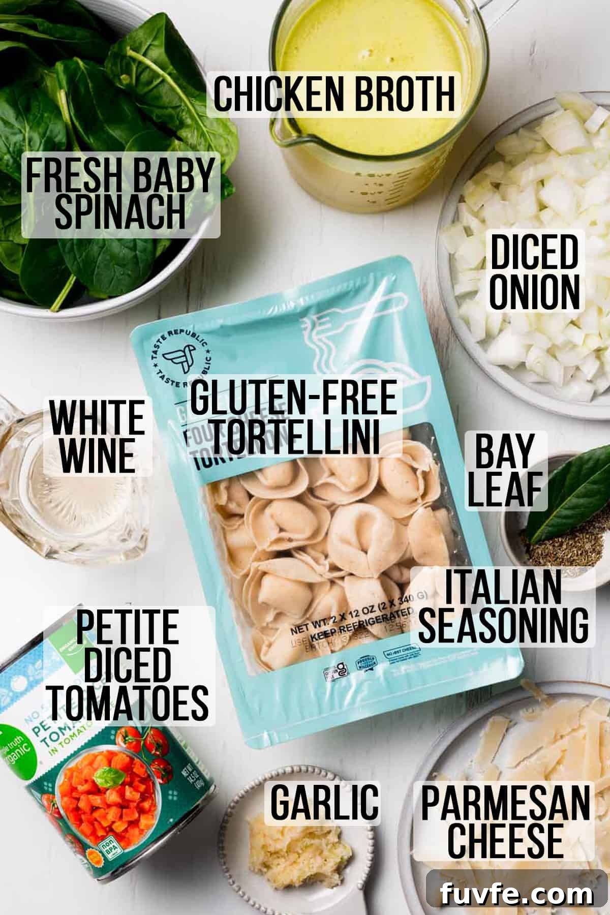 Ingredients needed for gluten free spinach tortellini soup measured in bowls on white surface.