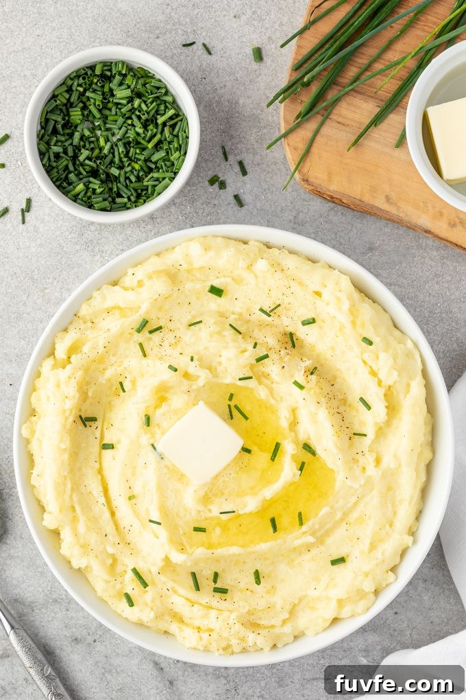 Yukon gold mashed potatoes with melting butter and chopped chives