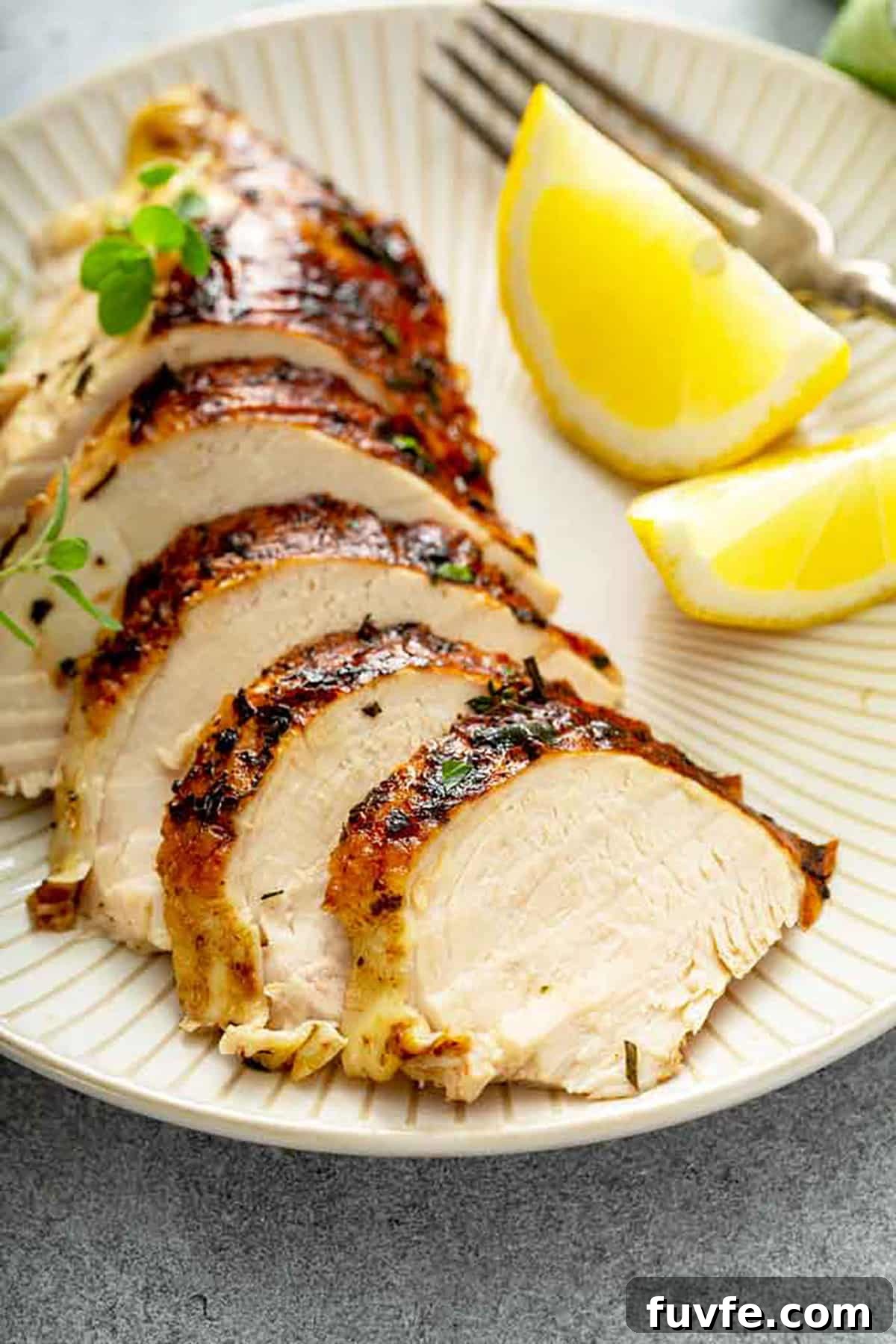 Herb-Butter Roast Chicken Recipe for Juicy Crispy Skin 13 Sliced roast chicken on a plate