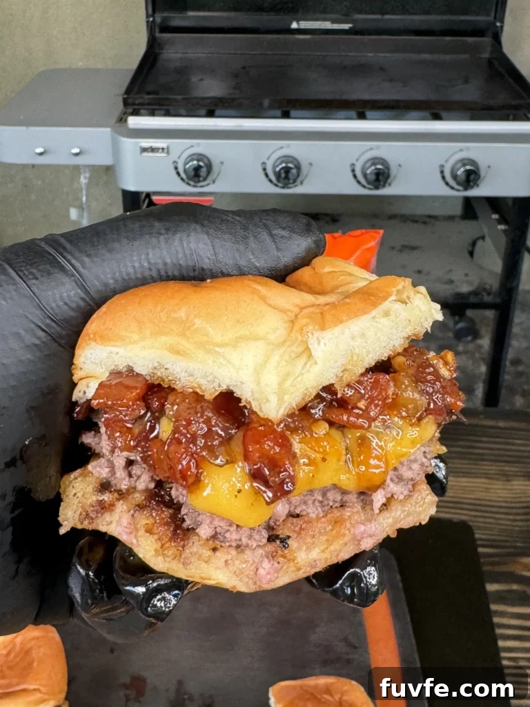 Bacon Jam Cheeseburger Sliders Recipe for Party Appetizers 3 holing a bacon jam slider