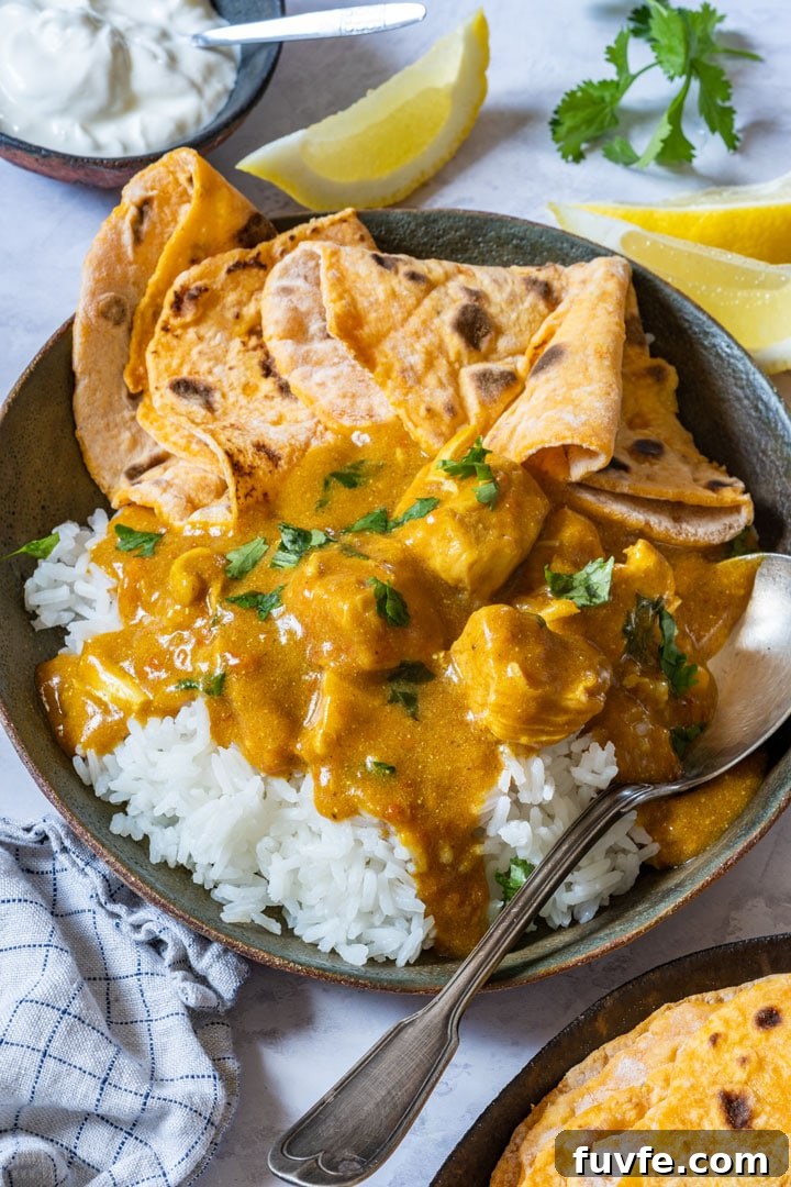 Bowl of chicken tikka masala with rice