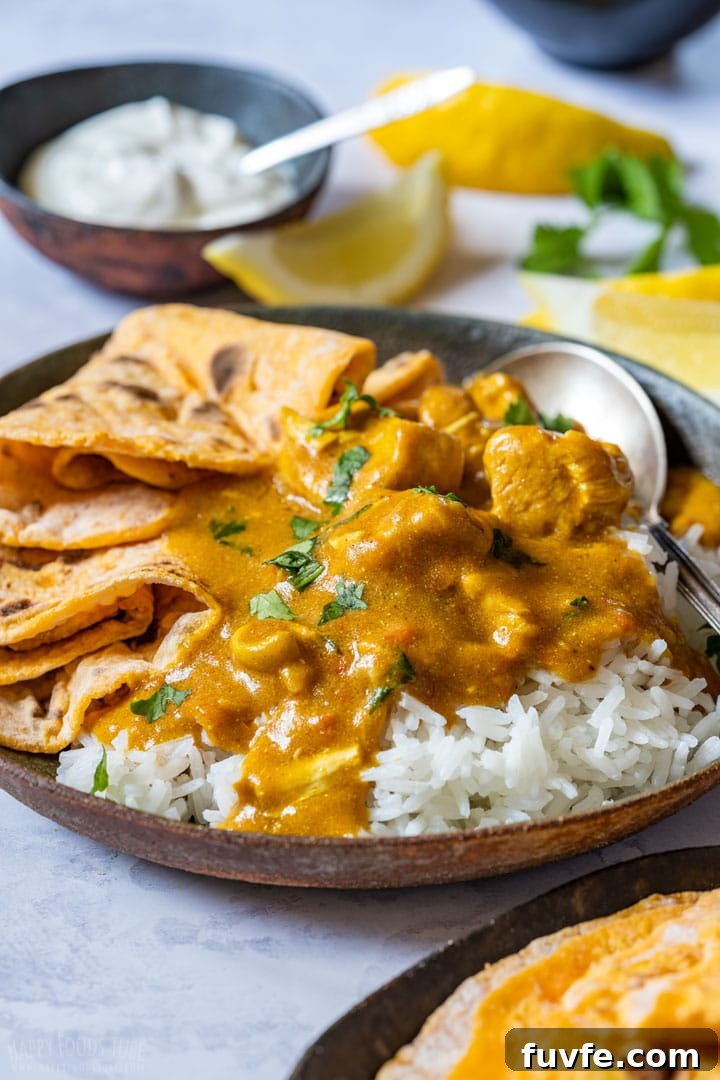Chicken tikka masala with flatbread and rice