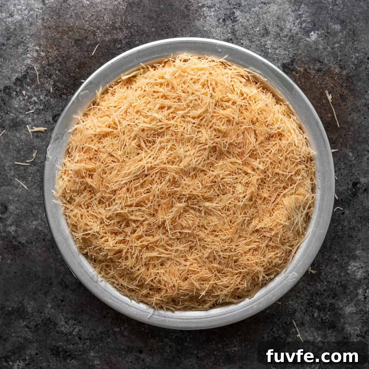 overhead: top layer of filo dough in a 9-inch pan