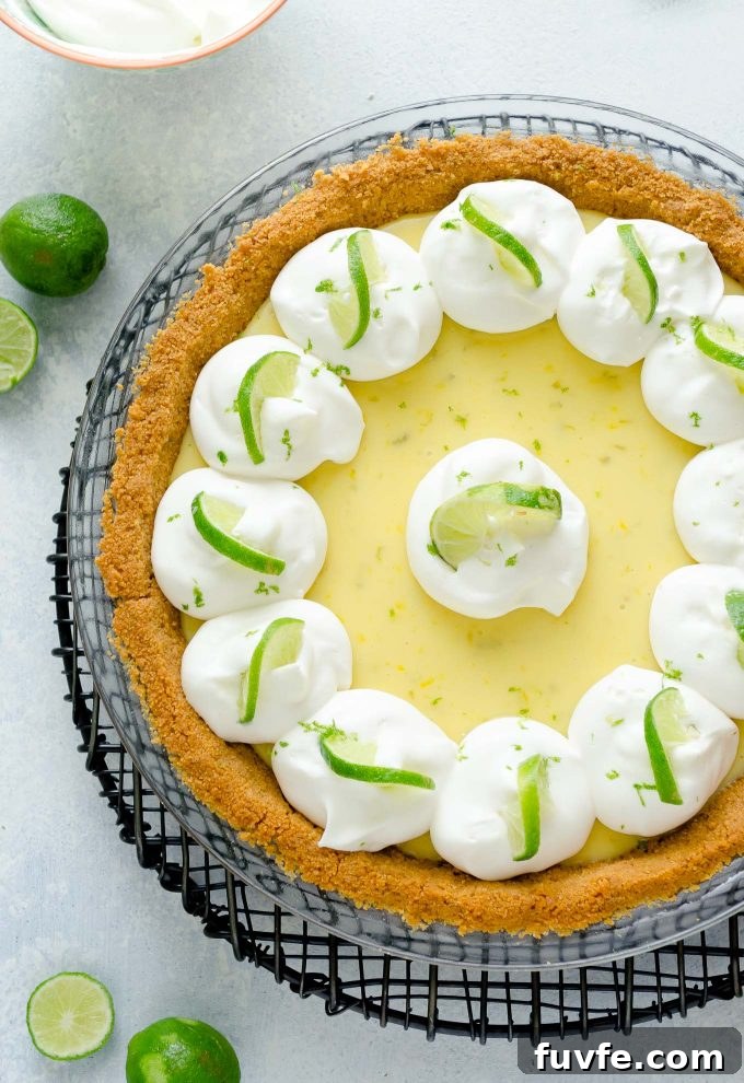 Authentic Key Lime Pie Recipe with Creamy Filling 2 Key lime pie with whipped cream and lime slices