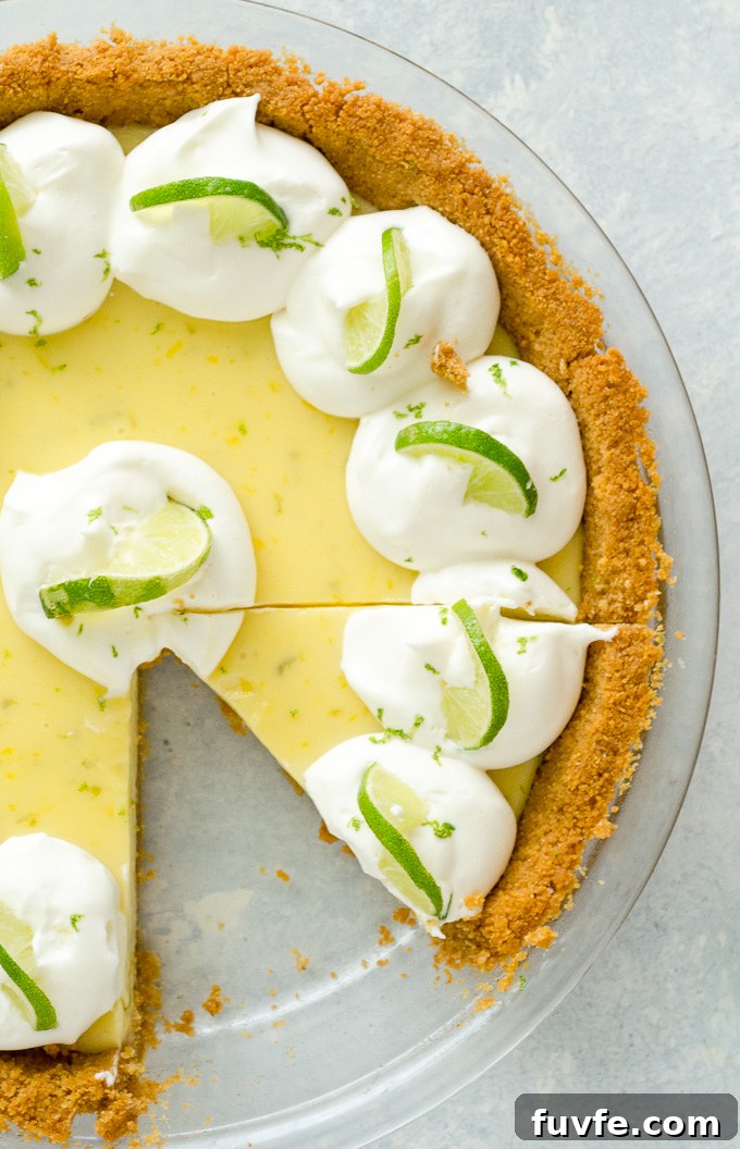 Authentic Key Lime Pie Recipe with Creamy Filling 7 Key lime pie with slice removed