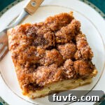 apple cake topped with a crunchy cinnamon sugar
