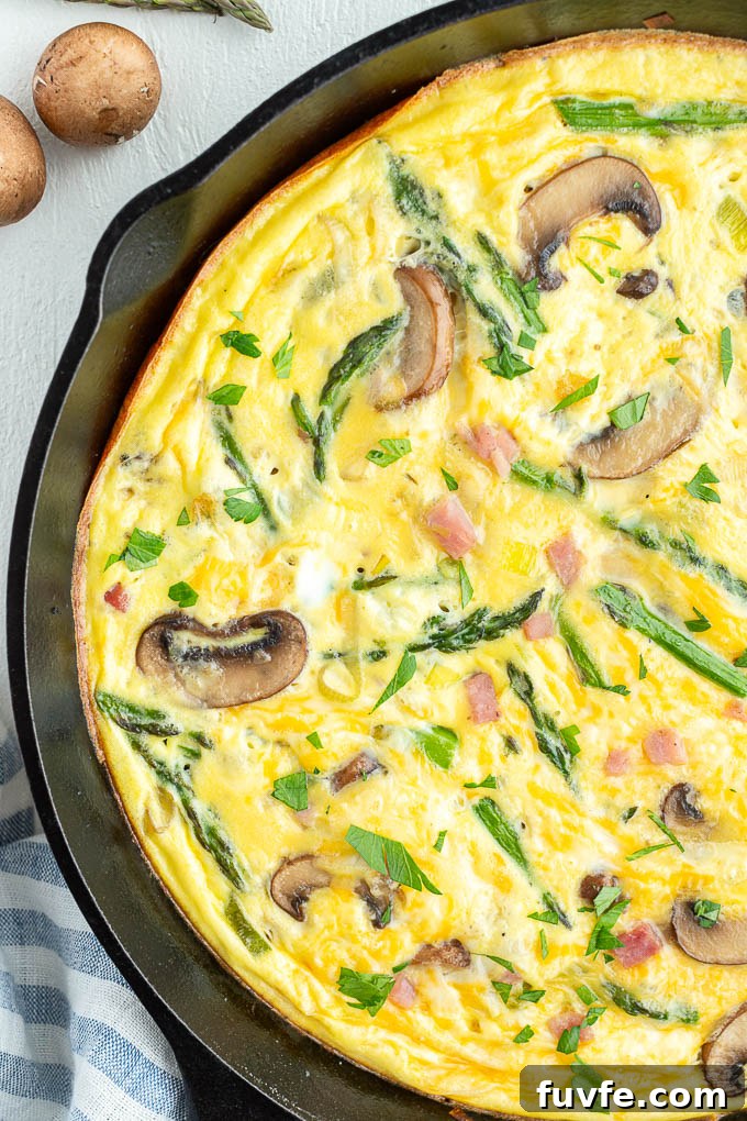 Ham and cheese frittata with asparagus and mushrooms