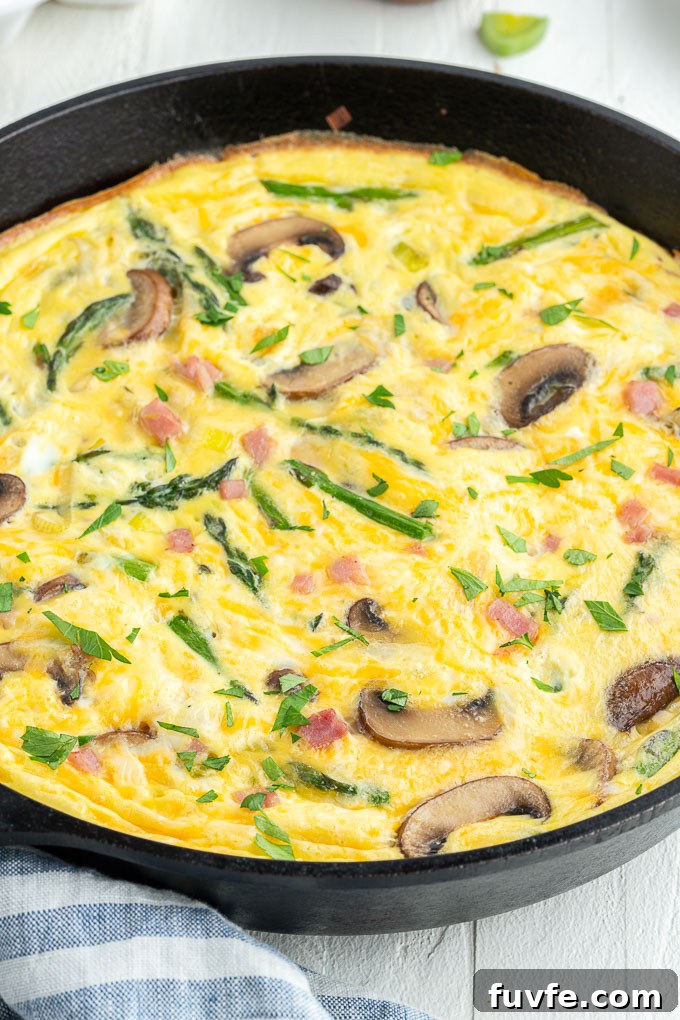 Savory Ham and Cheese Frittata for Brunch 6 Cheese and ham frittata in a skillet