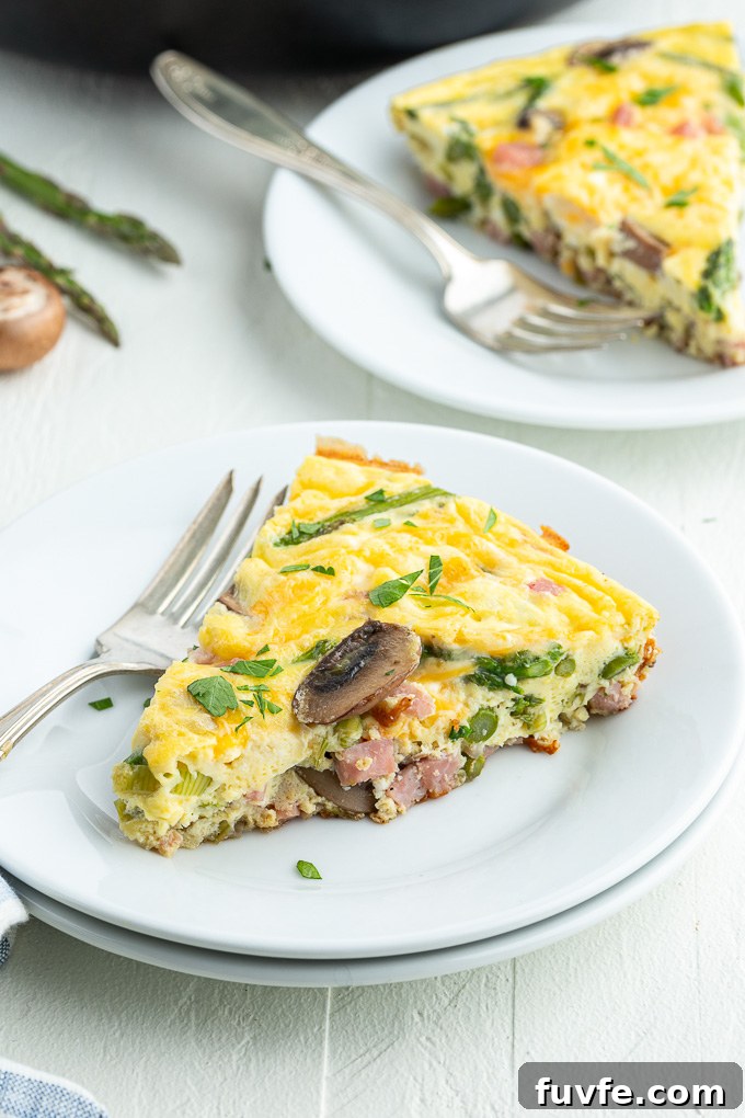 Savory Ham and Cheese Frittata for Brunch 7 Cheese and ham frittata on a plate