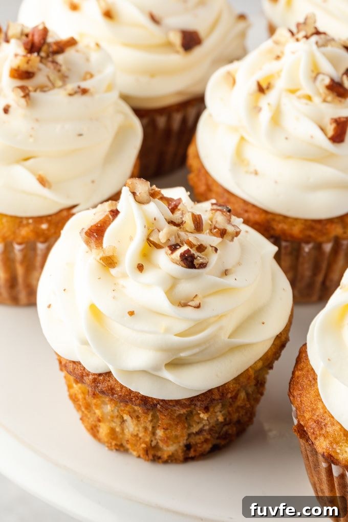 Hummingbird cupcakes frosted on a white plate
