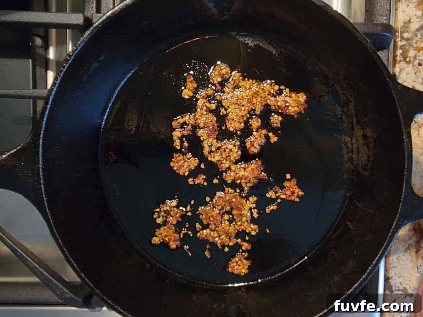 Parmesan Chili Crisp Fried Eggs: Crispy Sunny-Side with Heat 4 Chili crisp added to a hot skillet.