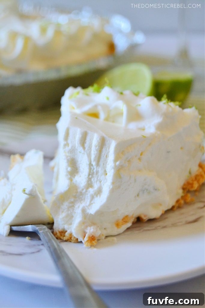 a closeup slice of a margarita pie with a bite missing