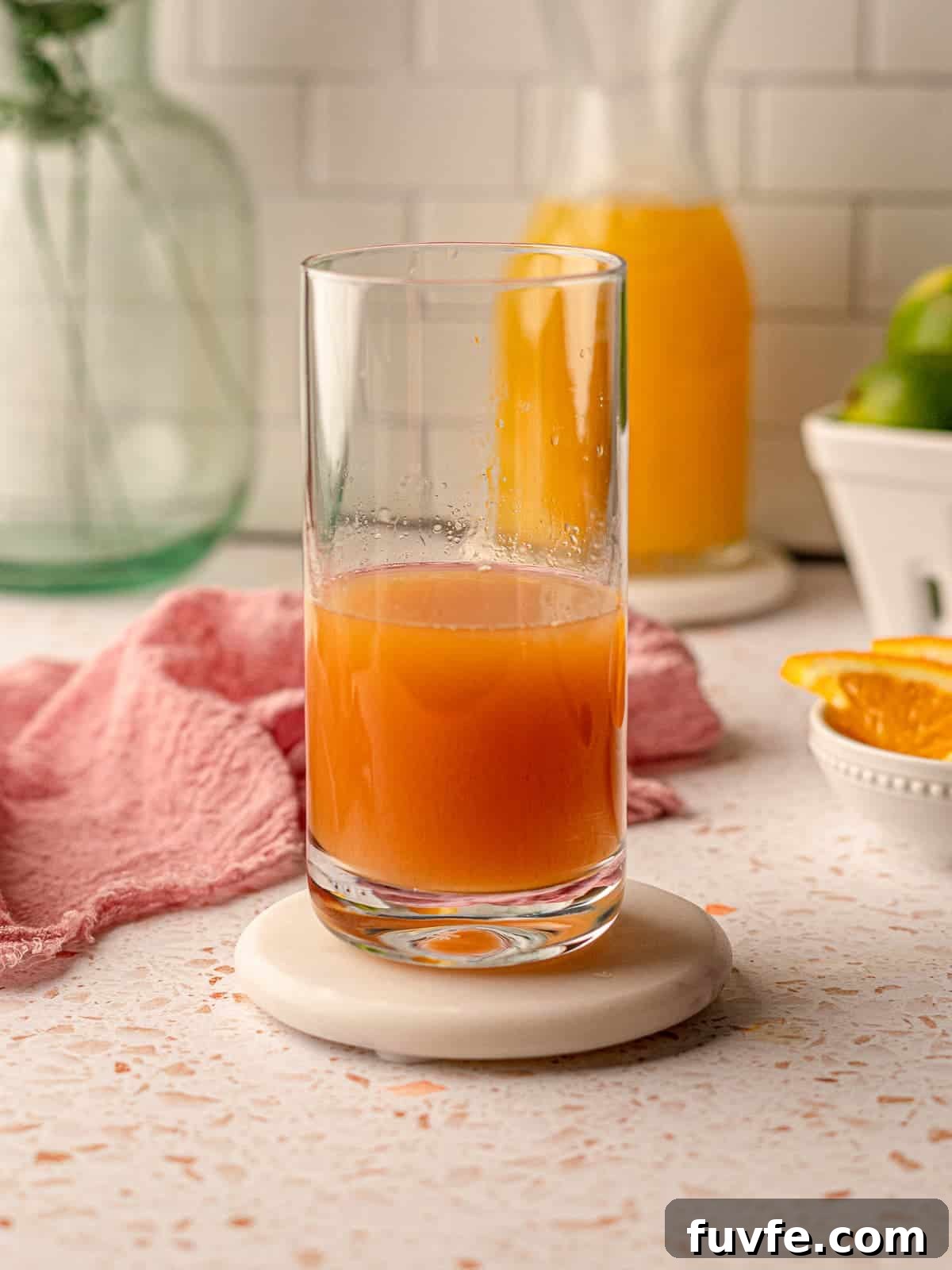 Authentic Jamaican Rum Punch Recipe for Tropical Cocktails 5 A glass half full of rum punch.