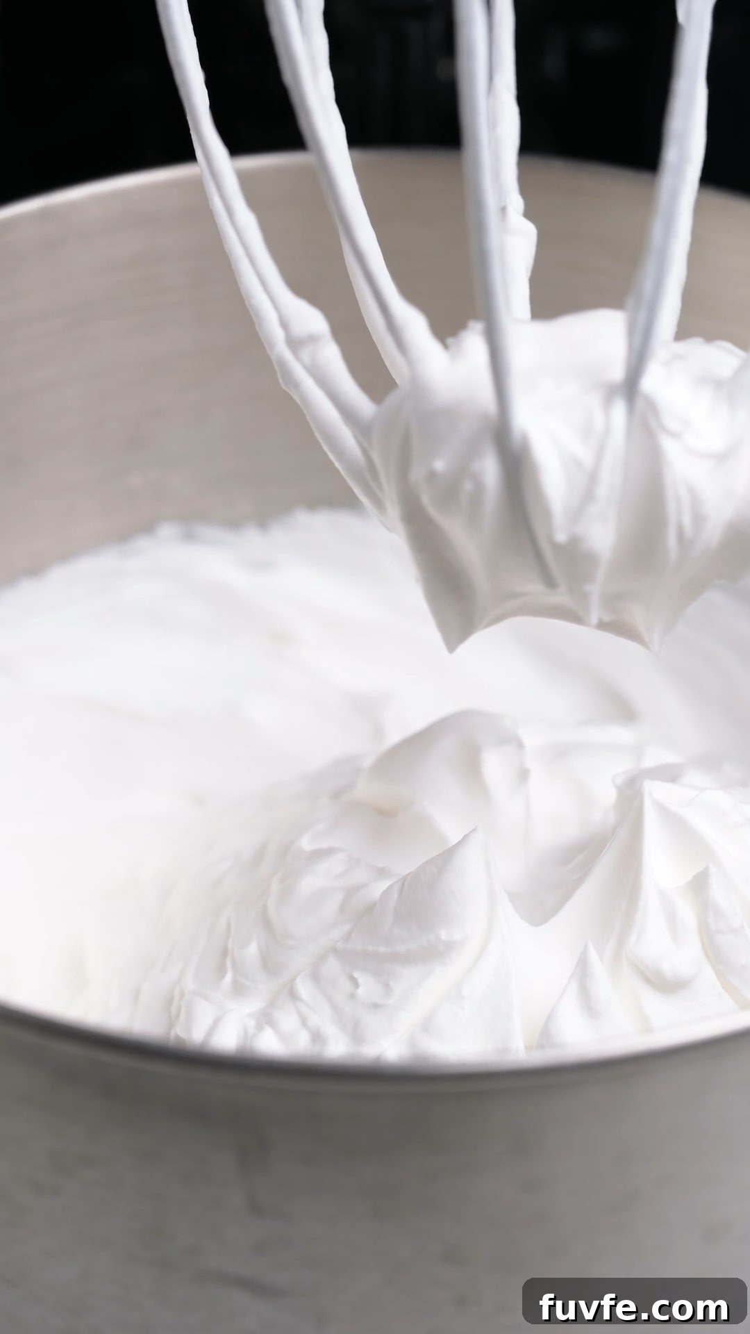 Bakery Tip: How to Make Stable Whipped Cream Frosting That Holds Up 7 Whipped cream whipped to stiff peaks with a stand mixer.