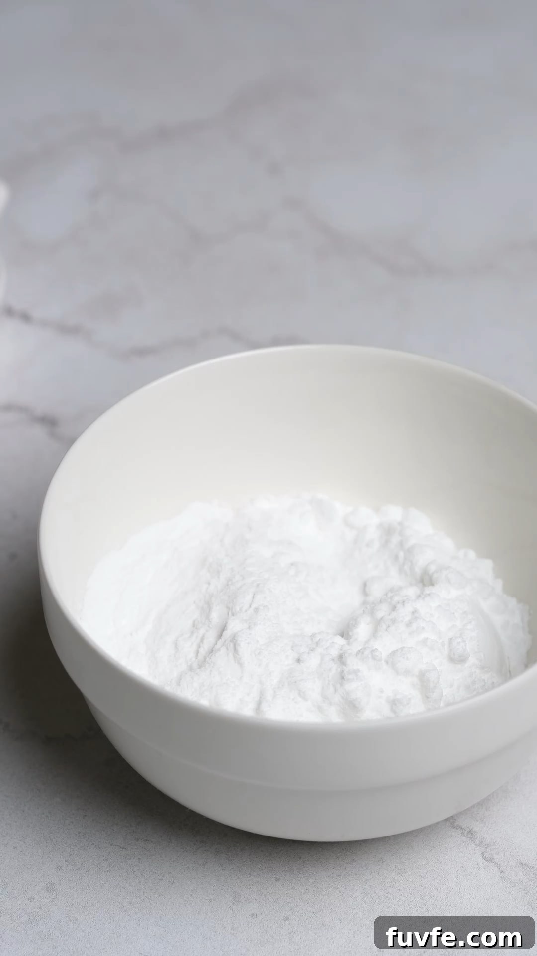 Bakery Tip: How to Make Stable Whipped Cream Frosting That Holds Up 8 A bowl of powdered sugar and instant clearjel for stabilized whipped cream.