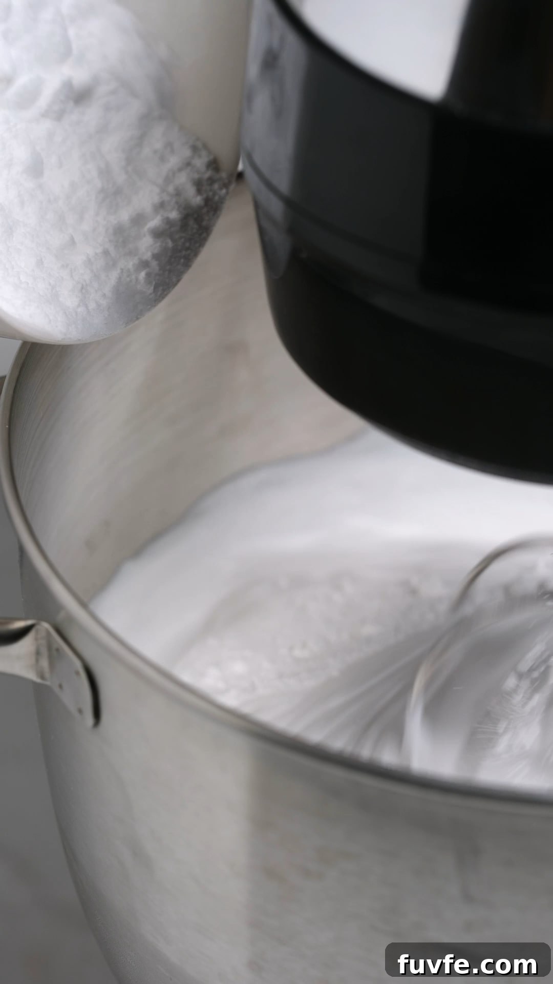 Bakery Tip: How to Make Stable Whipped Cream Frosting That Holds Up 9 Instant Clearjel and powdered sugar being added to whipped cream.