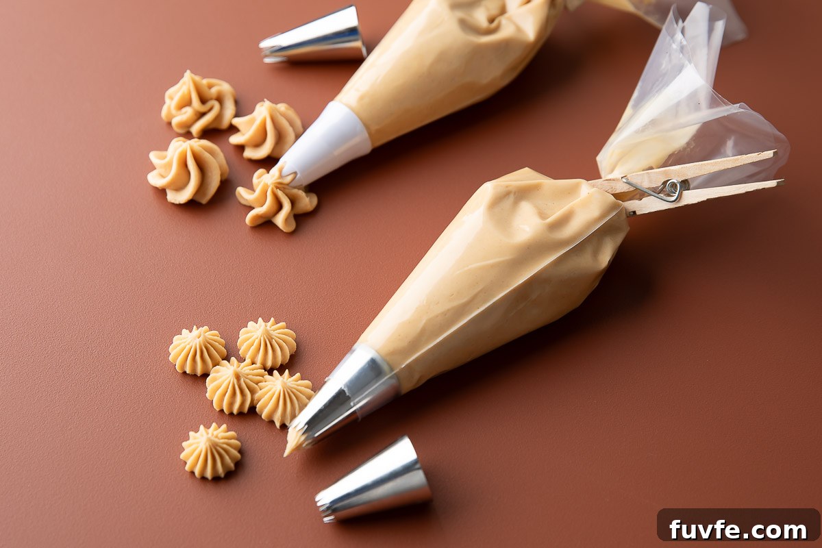 Peanut Butter Buttercream Frosting in Piping Bags with Assorted Tips