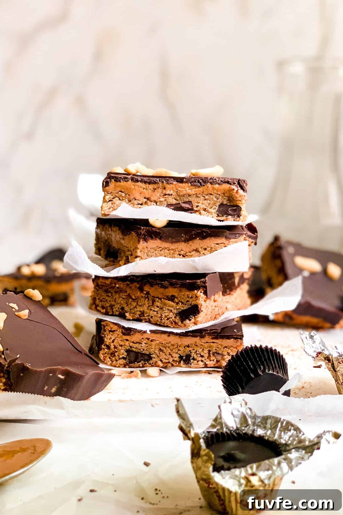 Stack of Homemade Dessert Bars with Peanut Butter and Melted Dark Chocolate