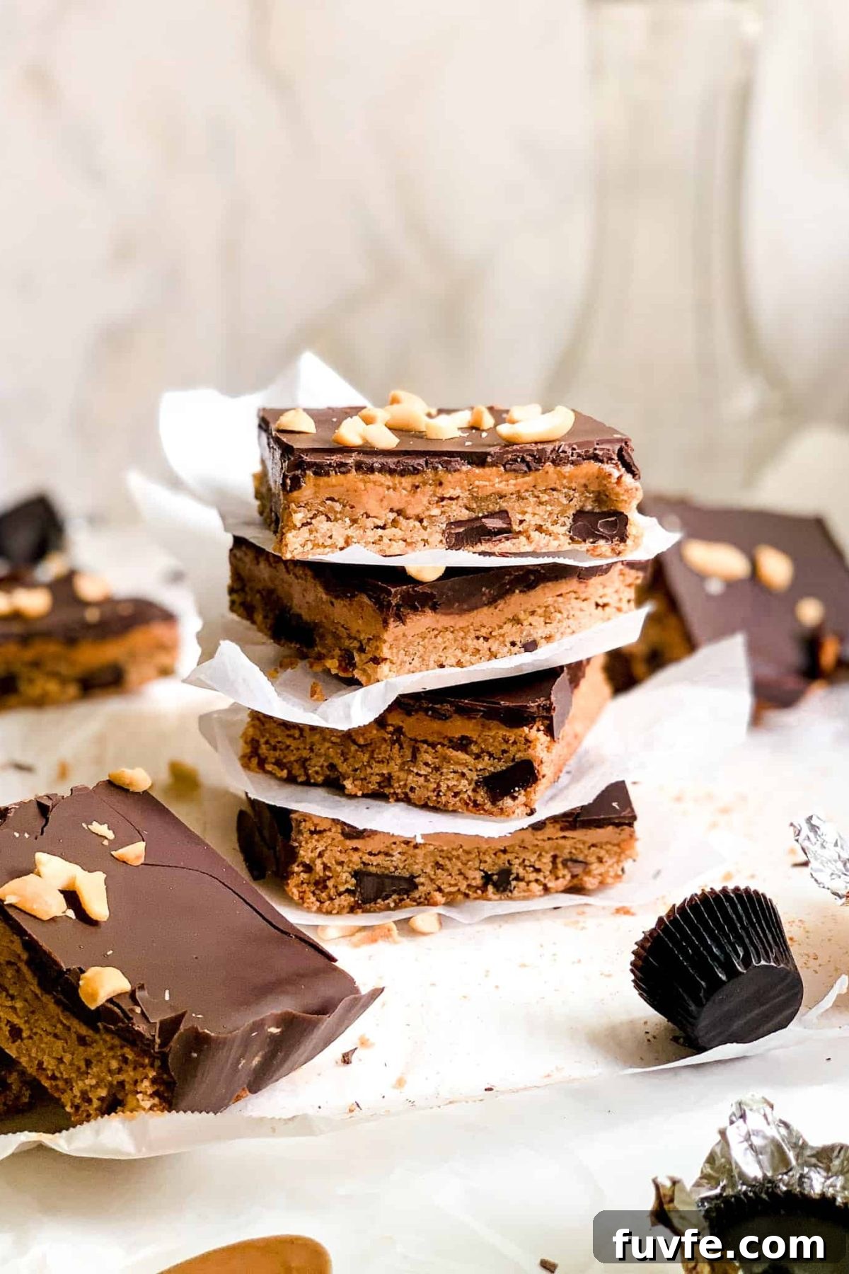 Stack of Homemade Dessert Bars with Peanut Butter and Melted Dark Chocolate