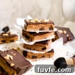 Stack of Homemade Dessert Bars with Peanut Butter and Melted Dark Chocolate