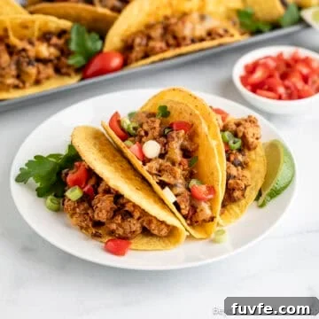Baked Ground Turkey Tacos on a white plate.